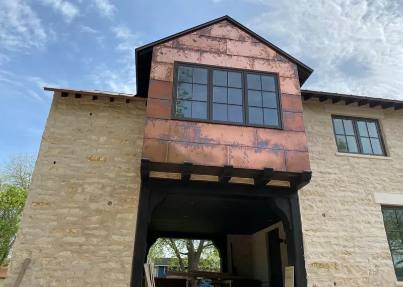 Copper metal panel facade on a stone building for Skylight Installation in Hopatcong